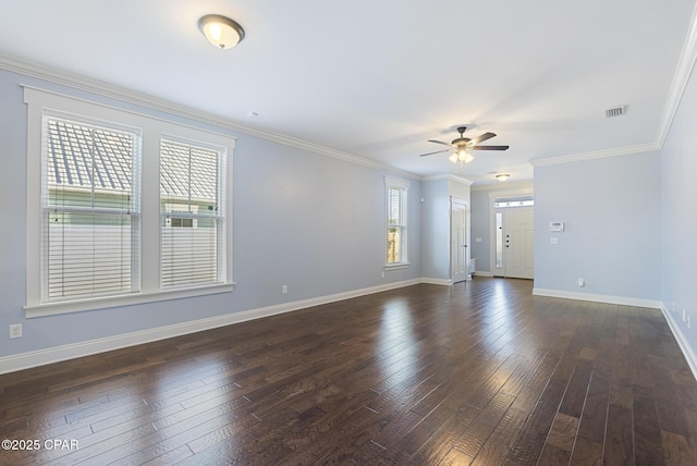 spare room with ceiling fan, dark hardwood / wood-style flooring, and ornamental molding