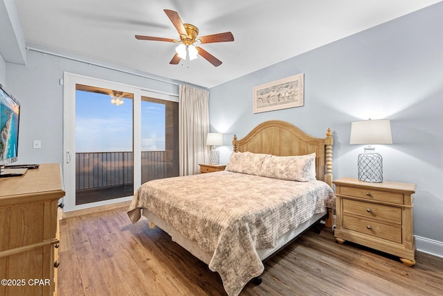 bedroom with access to exterior, ceiling fan, and hardwood / wood-style flooring