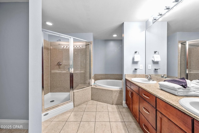 bathroom with vanity, tile patterned floors, and independent shower and bath