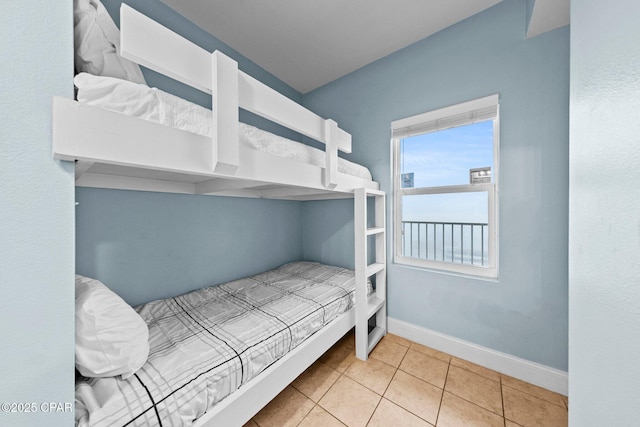 bedroom with light tile patterned flooring