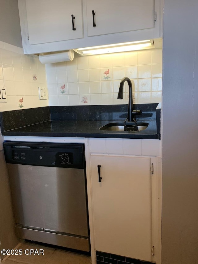 kitchen with white cabinets, backsplash, stainless steel dishwasher, and sink