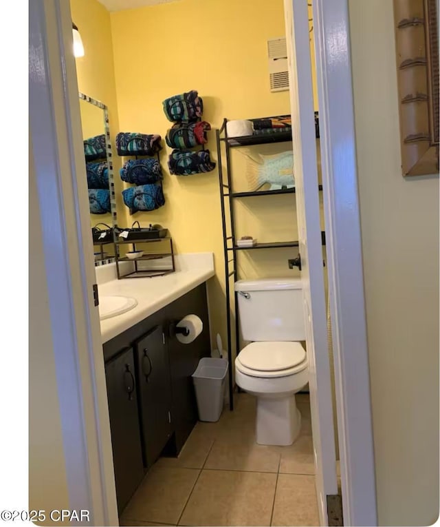 bathroom with tile patterned floors, vanity, and toilet