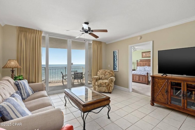 living room featuring floor to ceiling windows, light tile patterned floors, ceiling fan, and crown molding