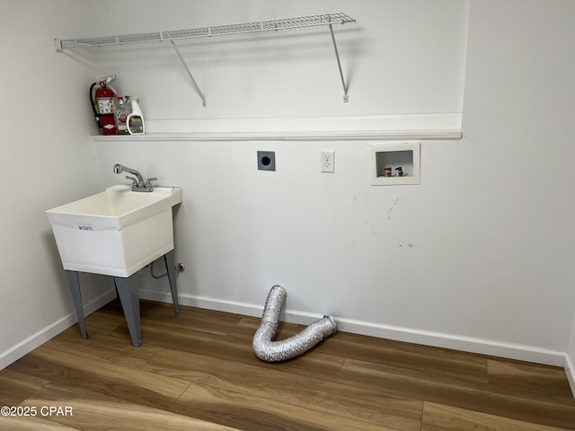 laundry area featuring hookup for an electric dryer, hardwood / wood-style flooring, and washer hookup