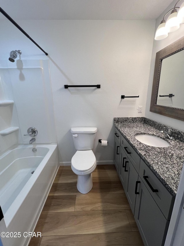 full bathroom with shower / tub combination, toilet, vanity, and hardwood / wood-style flooring