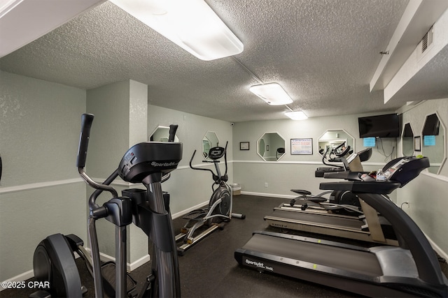 gym with a textured ceiling