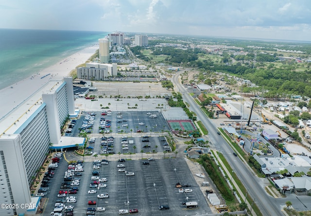 aerial view with a water view and a view of the beach