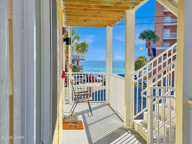 balcony featuring a water view