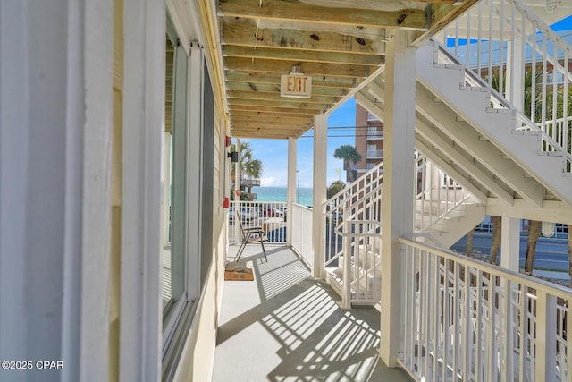 balcony featuring a water view