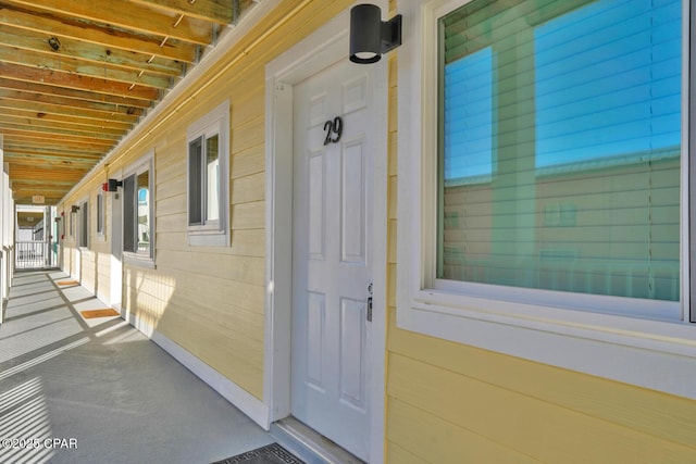 view of exterior entry with a porch