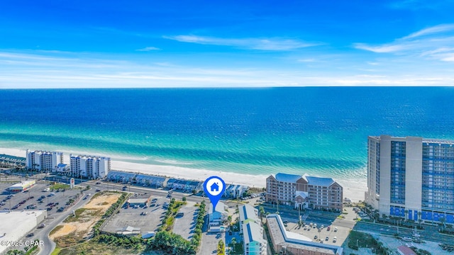 drone / aerial view with a water view and a view of the beach