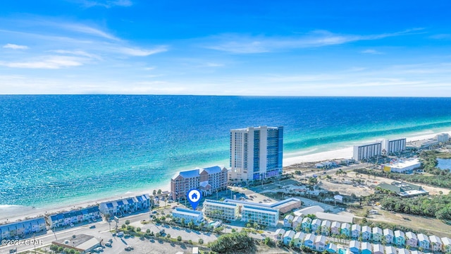 drone / aerial view featuring a view of the beach and a water view