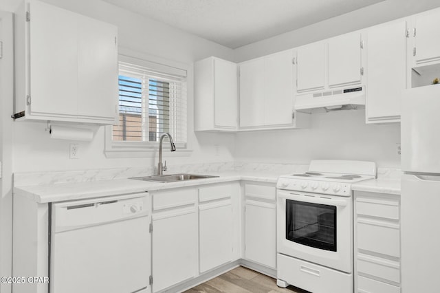 kitchen featuring white cabinetry, white appliances, sink, and light hardwood / wood-style flooring