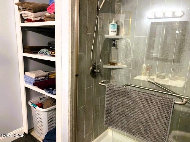 bathroom with a shower with shower door