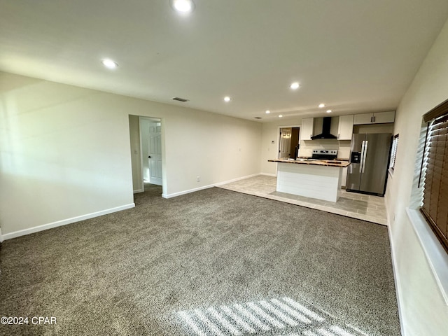 unfurnished living room with carpet