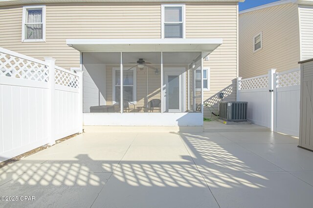 view of patio featuring ceiling fan, central AC unit, and a sunroom