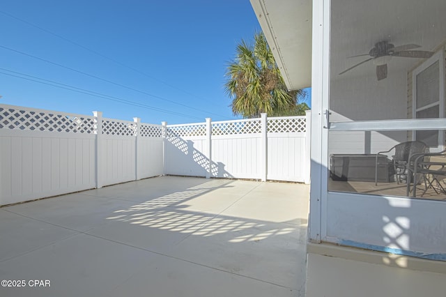 view of patio featuring a fenced backyard and a ceiling fan