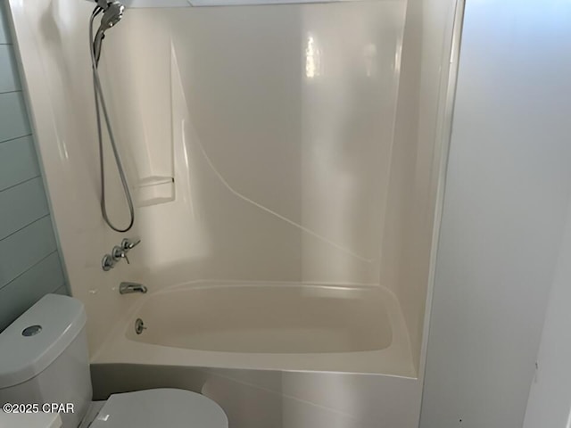 bathroom with shower / bathtub combination and toilet