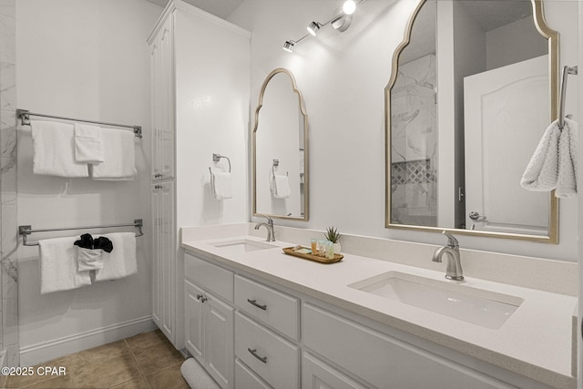 full bathroom featuring double vanity, a sink, and tile patterned floors