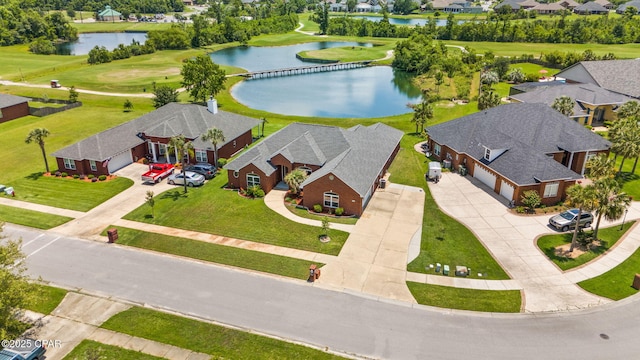 bird's eye view with a water view, view of golf course, and a residential view