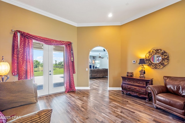 interior space with french doors, ornamental molding, and hardwood / wood-style flooring