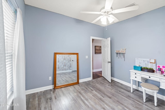 unfurnished office featuring ceiling fan and light hardwood / wood-style floors