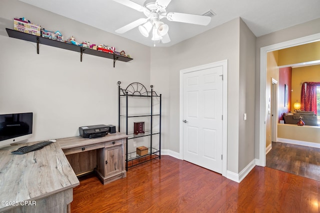 office featuring dark hardwood / wood-style floors and ceiling fan