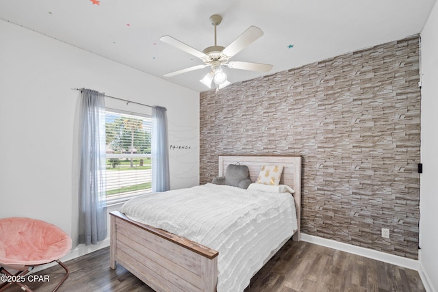 bedroom with dark hardwood / wood-style floors and ceiling fan