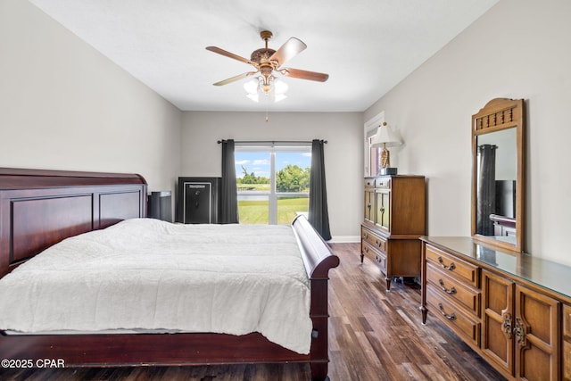 bedroom with ceiling fan and dark hardwood / wood-style floors