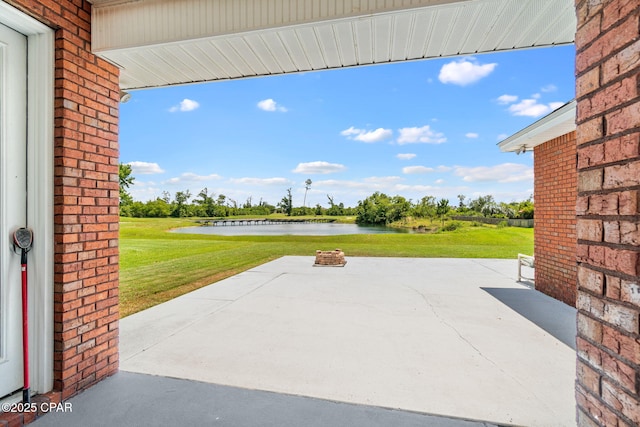 view of patio featuring a water view