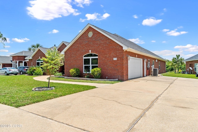 view of front facade with a garage, central air condition unit, and a front lawn