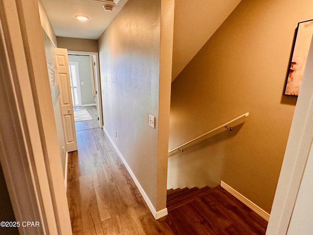 hall with hardwood / wood-style floors