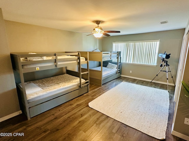 bedroom featuring dark hardwood / wood-style floors and ceiling fan