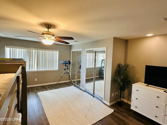 unfurnished bedroom featuring ceiling fan and dark hardwood / wood-style floors