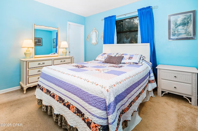 bedroom featuring carpet flooring and baseboards