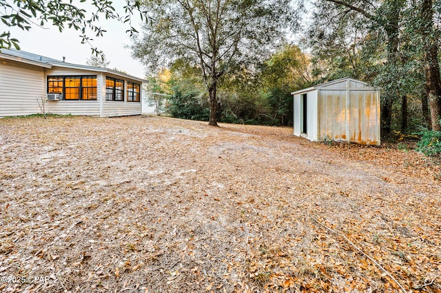 view of yard with a storage unit and an outdoor structure