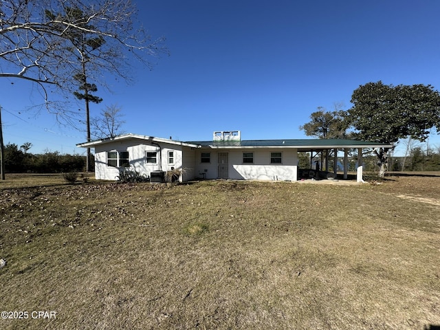 single story home with a carport