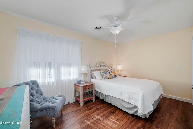 bedroom featuring ceiling fan and dark hardwood / wood-style floors