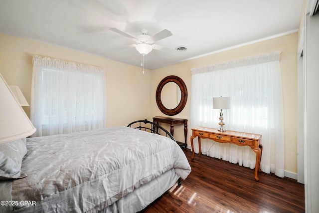 bedroom featuring ceiling fan and dark hardwood / wood-style floors