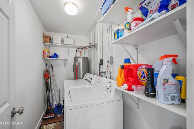 laundry area with independent washer and dryer and electric water heater