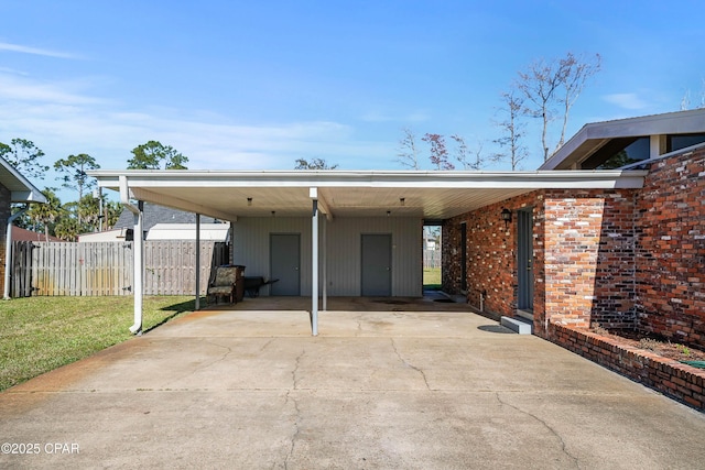 view of parking featuring a carport and a lawn