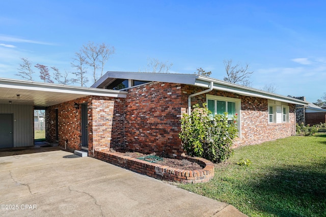 view of property exterior featuring a lawn and a carport