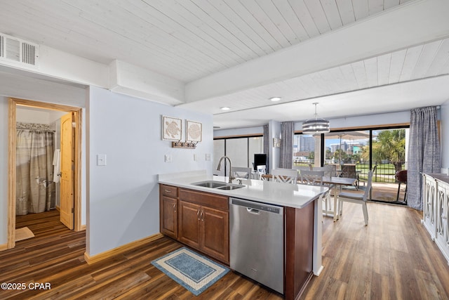 kitchen with decorative light fixtures, sink, dishwasher, and kitchen peninsula