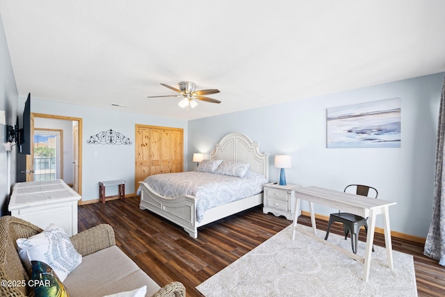 bedroom with ceiling fan and dark hardwood / wood-style flooring