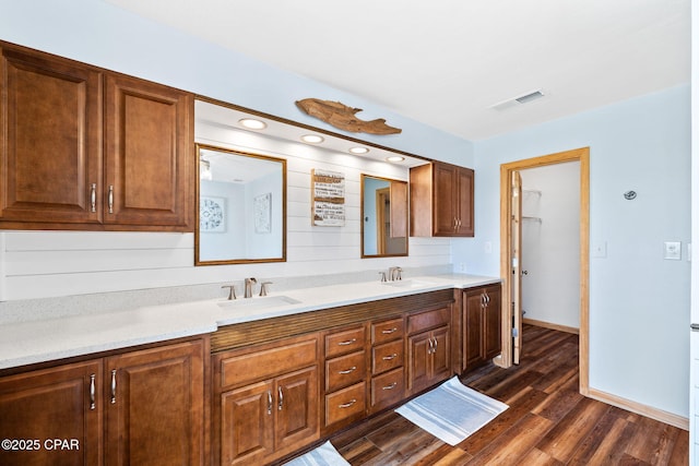 bathroom with vanity and wood-type flooring