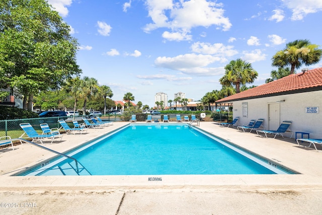 view of pool featuring a patio