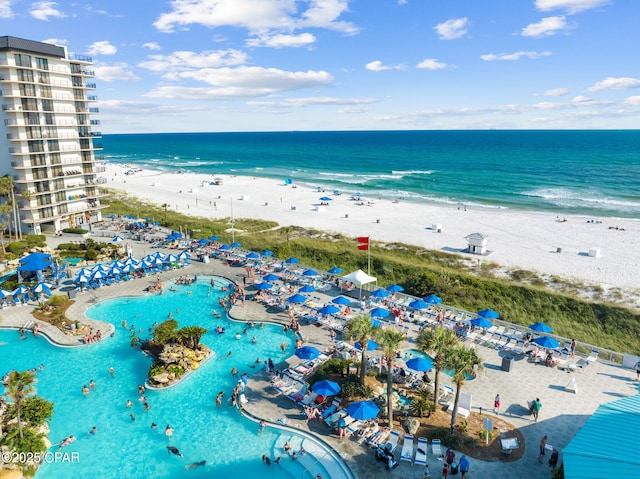 drone / aerial view with a water view and a view of the beach