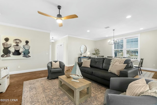 living room with ceiling fan with notable chandelier and ornamental molding