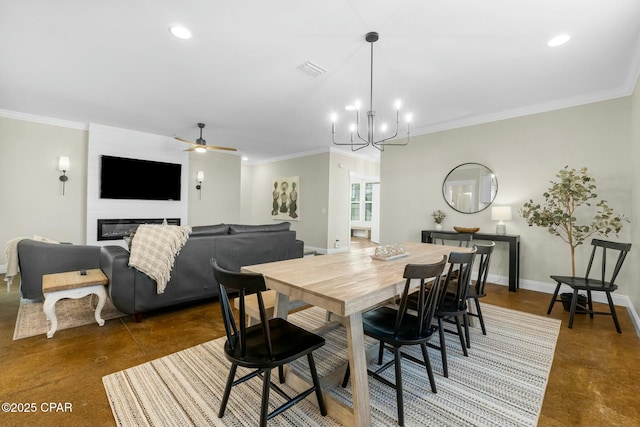 dining area featuring a fireplace, ceiling fan with notable chandelier, and ornamental molding