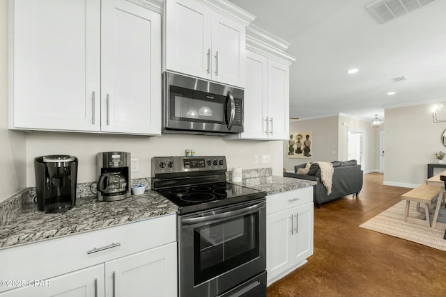 kitchen with white cabinets, appliances with stainless steel finishes, light stone counters, and crown molding